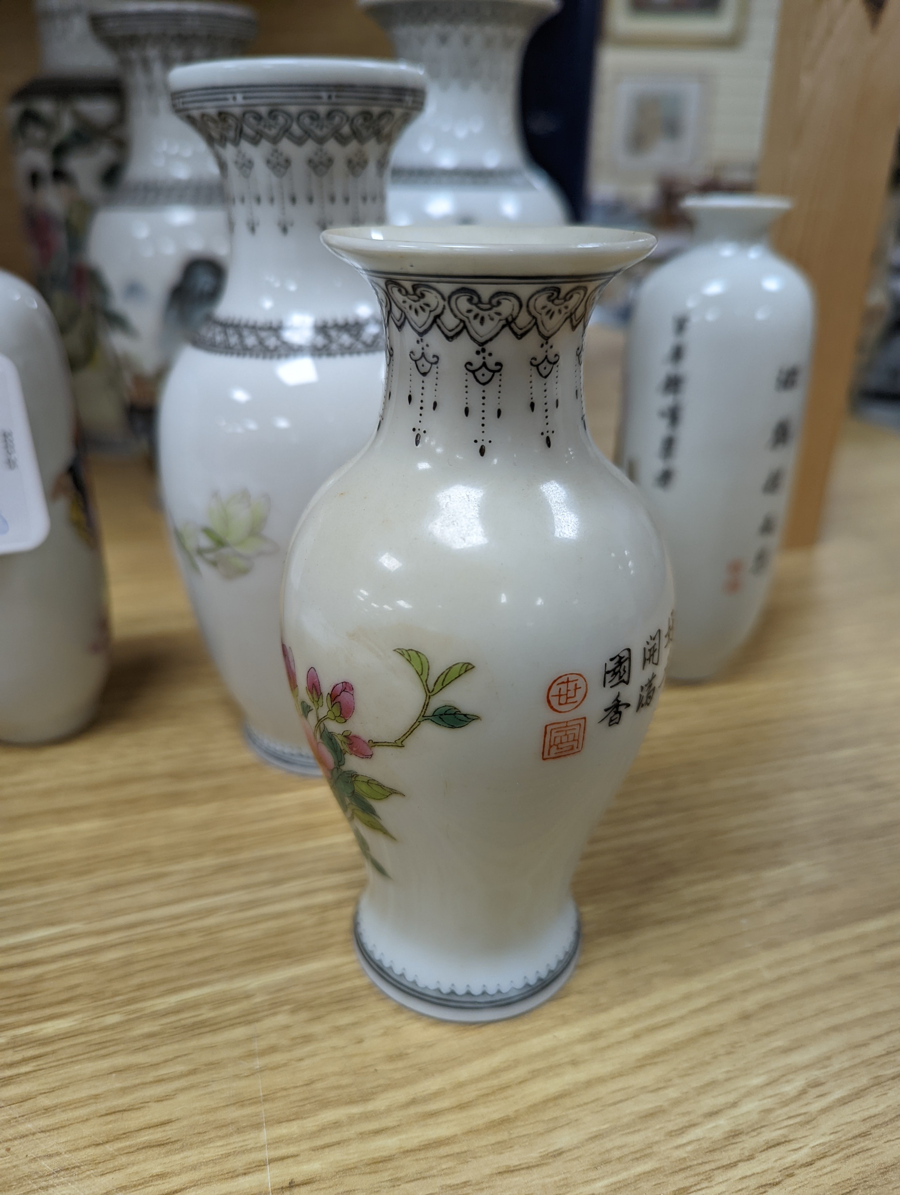 A group of seven Chinese famille rose vases, 20th century
